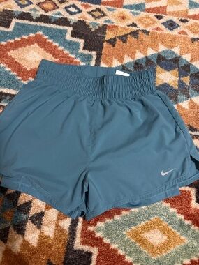 Women’s Nike dry fit running shorts. Teal